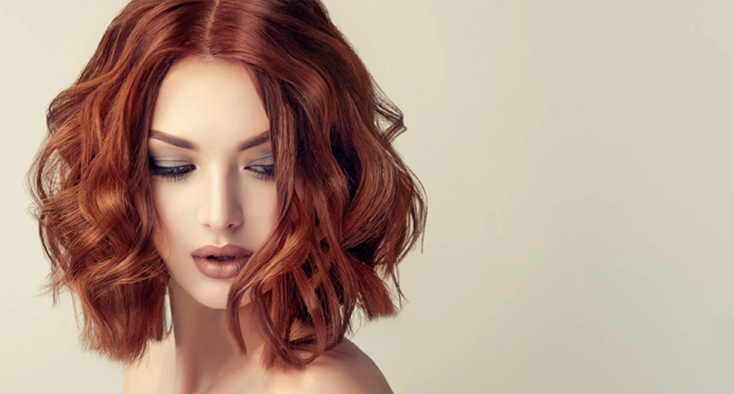 Professional copper hair colour on a textured bob hairstyle.